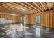Spacious unfinished basement with exposed beams and unique flooring design at 1618 Chancery Ln, Lithia Springs, GA 30122