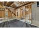 Unfinished basement area showing beams, flooring and exposed utility elements at 1618 Chancery Ln, Lithia Springs, GA 30122