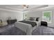 Serene bedroom with a tray ceiling, soft lighting, and a calming color scheme, creating a peaceful retreat at 1618 Chancery Ln, Lithia Springs, GA 30122