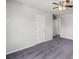 Spacious bedroom with carpet flooring and two separate door openings at 1618 Chancery Ln, Lithia Springs, GA 30122