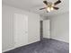 Bedroom with plush carpeting, ceiling fan, and natural light at 1618 Chancery Ln, Lithia Springs, GA 30122