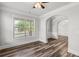 Inviting entryway with wood-look floors, an archway, and a view into the dining room at 1618 Chancery Ln, Lithia Springs, GA 30122