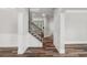 Bright entryway with hardwood floors, white walls, and staircase to upper level at 1618 Chancery Ln, Lithia Springs, GA 30122