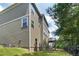 Back view of house with upper and lower wooden decks and yard at 1618 Chancery Ln, Lithia Springs, GA 30122