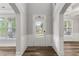 Welcoming foyer with wood floors, a stylish front door, and plenty of natural light for a warm greeting at 1618 Chancery Ln, Lithia Springs, GA 30122