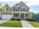 Charming two-story home with a welcoming front porch and well-manicured lawn at 1618 Chancery Ln, Lithia Springs, GA 30122