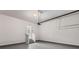 A clean and spacious two-car garage with stairs to the house at 1618 Chancery Ln, Lithia Springs, GA 30122