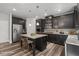 Stylish kitchen with dark cabinetry, granite countertops, and stainless steel appliances at 1618 Chancery Ln, Lithia Springs, GA 30122