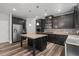Modern kitchen with granite countertops, stainless steel appliances, and a center island at 1618 Chancery Ln, Lithia Springs, GA 30122