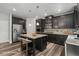 Modern kitchen with stainless steel appliances, a center island, and ample cabinet space for storage at 1618 Chancery Ln, Lithia Springs, GA 30122