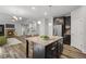 Open kitchen with granite island, stainless appliances, and view to the cozy living area at 1618 Chancery Ln, Lithia Springs, GA 30122
