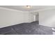 Spacious living room with neutral paint, plush carpeting, and ample sunlight at 1618 Chancery Ln, Lithia Springs, GA 30122
