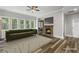 Inviting living room with a cozy fireplace, large windows, and comfortable seating, ideal for relaxation at 1618 Chancery Ln, Lithia Springs, GA 30122