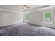 Spacious main bedroom with tray ceiling, ceiling fan and large, bright windows at 1618 Chancery Ln, Lithia Springs, GA 30122