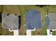 An aerial view shows rooftops, driveways, and lush green yards on a sunny day at 4234 Freight St, Tucker, GA 30084