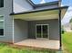 Covered back porch with sliding glass doors offers easy access to the outdoors at 4234 Freight St, Tucker, GA 30084
