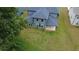 A view of a home's rear exterior with lots of windows and a covered patio at 4234 Freight St, Tucker, GA 30084