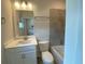 Bathroom with single vanity, modern fixtures, and shower and tub at 4234 Freight St, Tucker, GA 30084