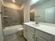 Well-lit bathroom featuring a modern vanity and stylish tile work in the shower area at 4234 Freight St, Tucker, GA 30084
