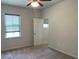 Bedroom with ceiling fan, window, and a closet at 4234 Freight St, Tucker, GA 30084