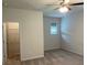 Carpeted bedroom featuring a ceiling fan, window and closet at 4234 Freight St, Tucker, GA 30084