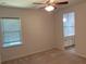 Bedroom features a ceiling fan, carpet flooring, and an attached bathroom at 4234 Freight St, Tucker, GA 30084