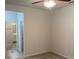 Bedroom with ceiling fan and access to an adjoining bathroom at 4234 Freight St, Tucker, GA 30084