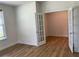 Bedroom with wood floors and glass paneled french doors leading into another room at 4234 Freight St, Tucker, GA 30084