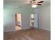Bedroom featuring a ceiling fan and access to a bathroom and closet at 4234 Freight St, Tucker, GA 30084