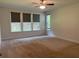 Spacious bedroom with large windows overlooking the fenced-in backyard at 4234 Freight St, Tucker, GA 30084