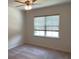Bright bedroom with ceiling fan and large window for natural light at 4234 Freight St, Tucker, GA 30084