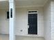 Inviting front entrance with a classic black door, a white brick surround, and a clear address at 4234 Freight St, Tucker, GA 30084