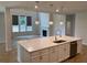 Bright kitchen island with quartz countertop, stainless steel appliances, and modern pendant lighting at 4234 Freight St, Tucker, GA 30084