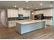Spacious kitchen featuring a large island, stainless steel appliances, and white cabinetry at 4234 Freight St, Tucker, GA 30084