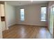 Open living space with wood-look floors, ample natural light, and sliding glass door access to outdoors at 4234 Freight St, Tucker, GA 30084