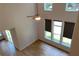 Bright living room featuring a ceiling fan and multiple windows with backyard views at 4234 Freight St, Tucker, GA 30084