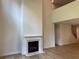 Elegant living room with fireplace, tall ceilings, wood flooring, and stairway to the next level at 4234 Freight St, Tucker, GA 30084
