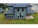 The house's rear exterior features large windows, neutral siding, and an inviting covered patio at 4234 Freight St, Tucker, GA 30084