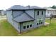 A spacious backyard and modern home exterior featuring a cozy covered patio at 4234 Freight St, Tucker, GA 30084