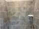 Bathroom features a modern tiled shower with bronze fixtures at 4234 Freight St, Tucker, GA 30084