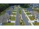 Aerial view of a neighborhood street, displaying manicured lawns and modern homes at 4234 Freight St, Tucker, GA 30084