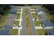 An aerial view of a neighborhood featuring well-maintained homes, lush lawns, and sidewalks at 4234 Freight St, Tucker, GA 30084