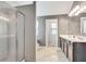 Bathroom with dual sinks, vanity, walk in shower, and tile flooring at 529 Dasheill Ln, Atlanta, GA 30349