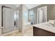 Bathroom features tiled floor, glass shower, soaking tub and vanity with sink at 529 Dasheill Ln, Atlanta, GA 30349