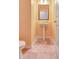 Bright half bathroom with tile flooring, a pedestal sink, and light colored walls at 529 Dasheill Ln, Atlanta, GA 30349