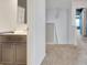 Upstairs bathroom with neutral colored walls, carpet and a dark colored vanity at 529 Dasheill Ln, Atlanta, GA 30349