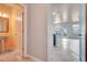 Inviting entryway features tile flooring, with a partial view into a half bathroom and kitchen at 529 Dasheill Ln, Atlanta, GA 30349