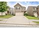 Two-story home with stone accents over the garage, well-kept lawn, and concrete driveway at 529 Dasheill Ln, Atlanta, GA 30349
