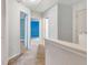 Upstairs hallway featuring neutral colored walls, carpet, and access to multiple bedrooms at 529 Dasheill Ln, Atlanta, GA 30349
