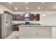 Well-lit kitchen with stainless steel appliances, granite countertops, and a functional island for food preparation at 529 Dasheill Ln, Atlanta, GA 30349